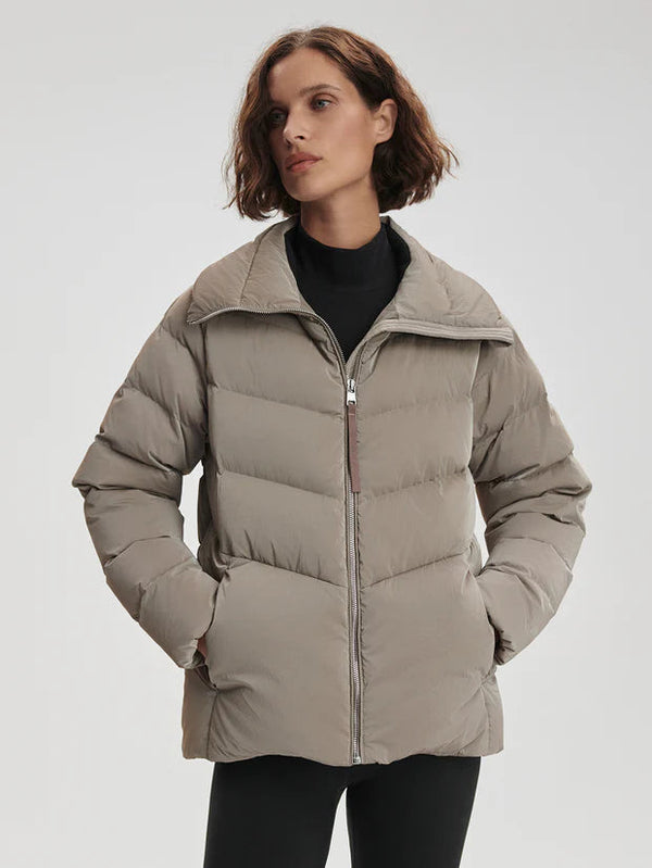 Black Liquid Nylon Puffer Jacket with Snap Pockets by TLJ