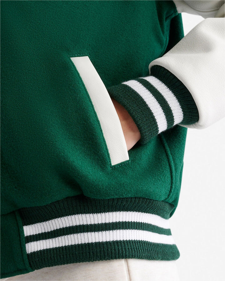 Women’s vintage varsity jacket with wool body and leather sleeves by TLJ