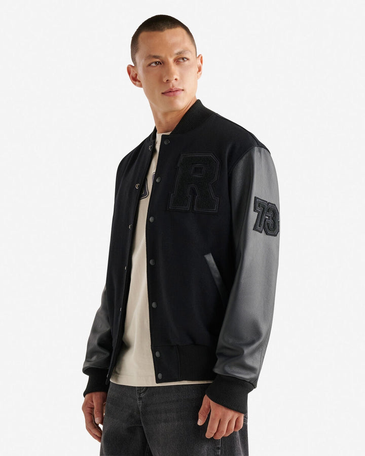 Men’s Vintage Varsity Jacket with leather sleeves and chenille crests – classic collegiate style.