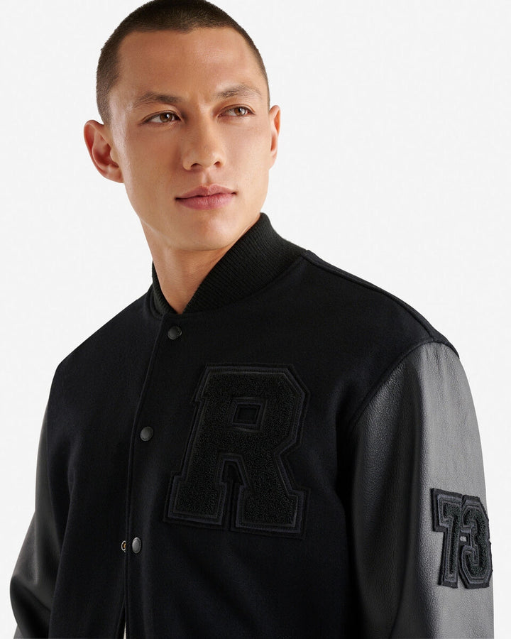 Men’s Vintage Varsity Jacket with leather sleeves and chenille crests – classic collegiate style.