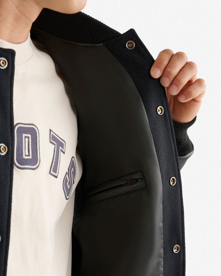 Men’s Vintage Varsity Jacket with leather sleeves and chenille crests – classic collegiate style.