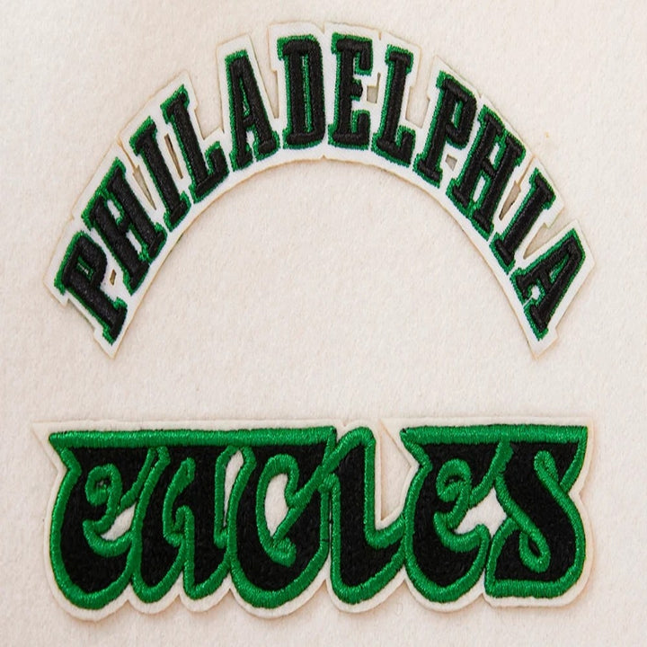 Women’s Philadelphia Eagles white and green varsity jacket with wool body and leather sleeves
