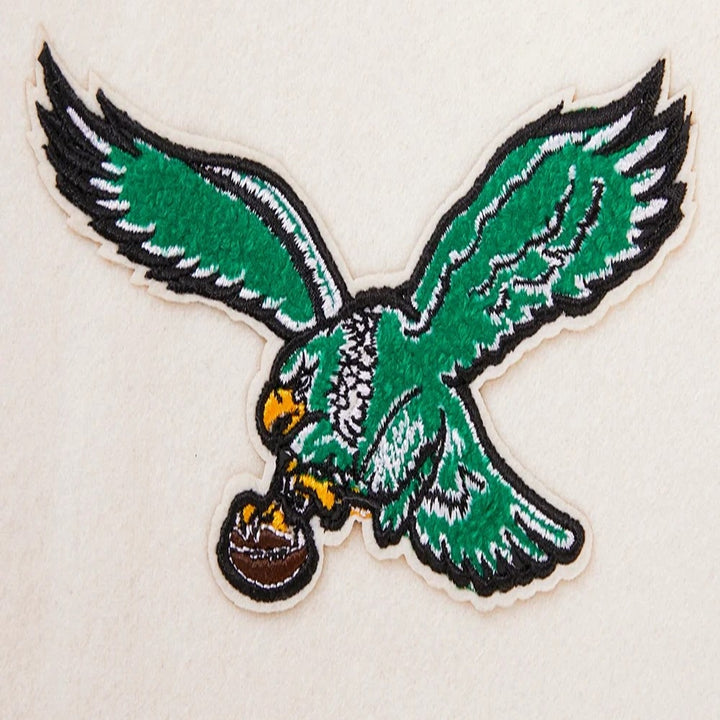 Women’s Philadelphia Eagles white and green varsity jacket with wool body and leather sleeves
