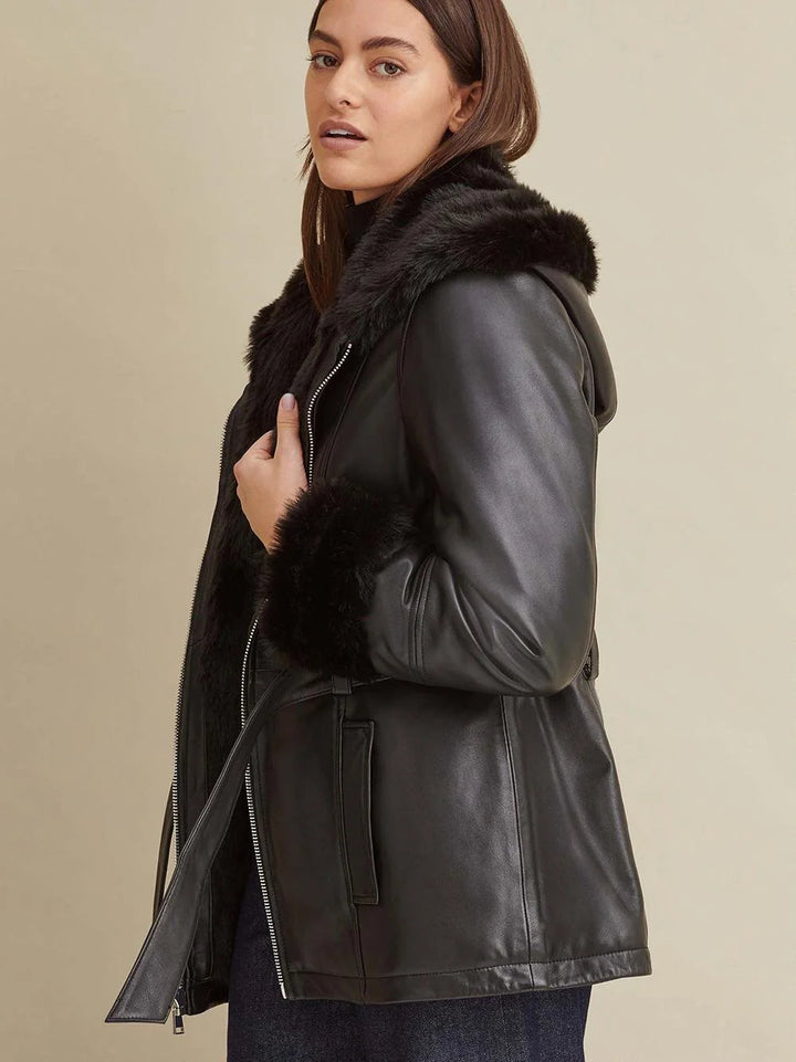 Back design of women’s black leather jacket with faux fur accents