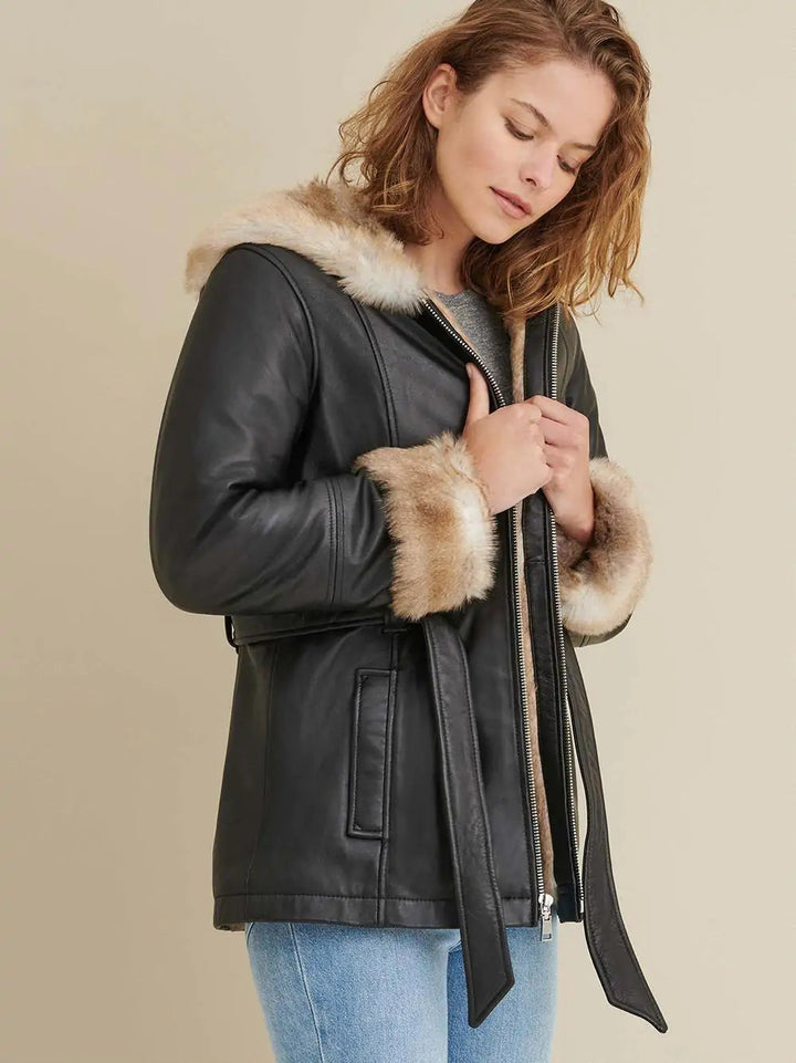 Back design of women’s black leather jacket with faux fur accents