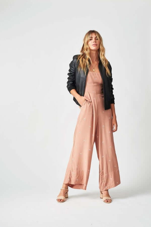 Woman wearing Women’s Bolzano Bomber Leather Jacket outdoors, styled for casual spring/autumn adventures