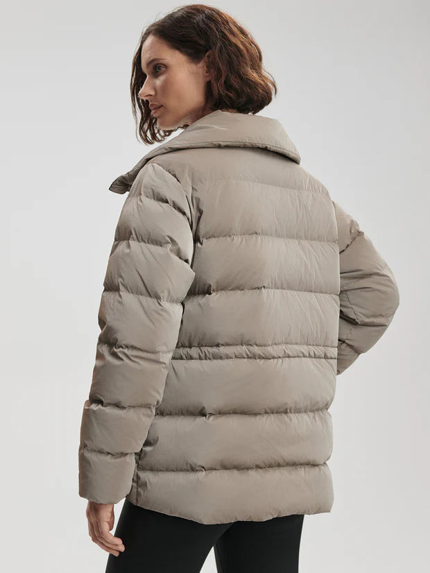 Black Liquid Nylon Puffer Jacket with Snap Pockets by TLJ
